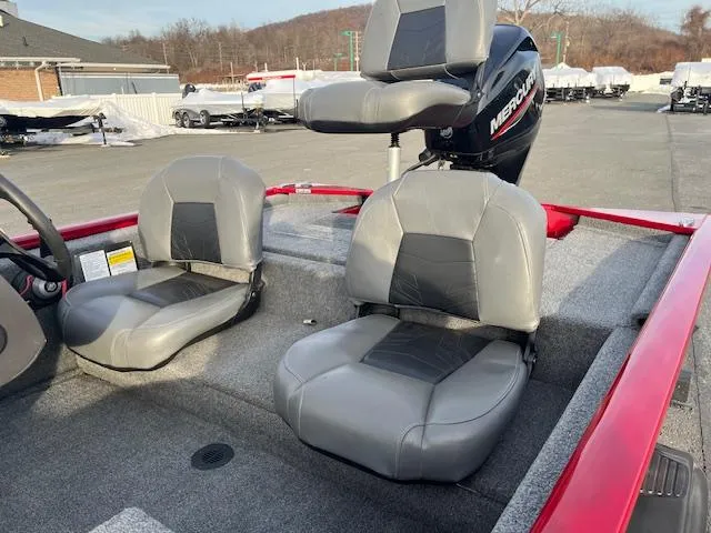 Slide: The Image of 2023 Tracker Pro 170 boat interior with gray seats and Mercury motor. - 5