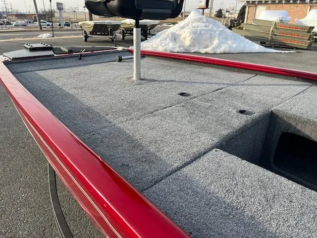 Slide: The Image of 2023 Tracker Pro 170 boat deck with red trim in outdoor setting. - 6