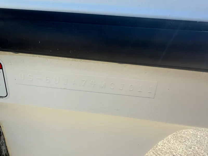 Slide: The Image of 2011 Mako 18 LTS Inshore boat hull identification number. - 17