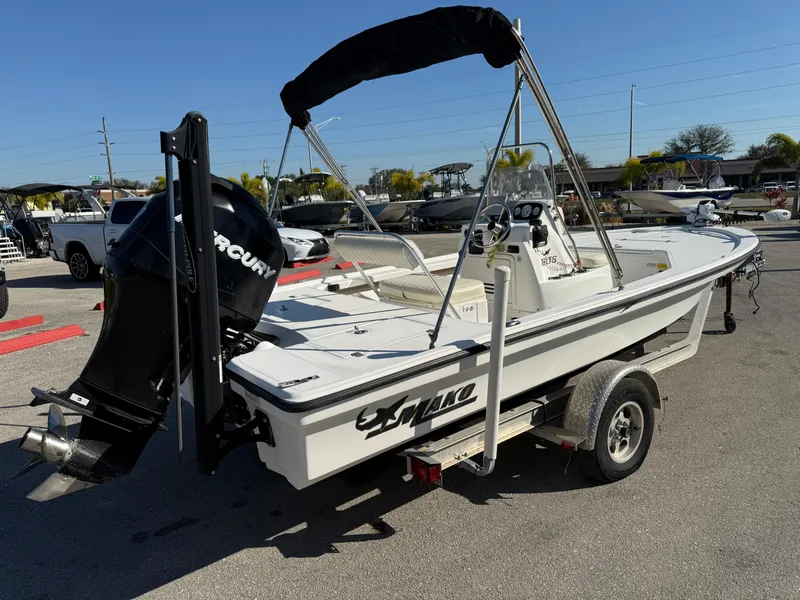 Slide: The Image of 2011 Mako 18 LTS Inshore boat with Mercury engine on trailer. - 5