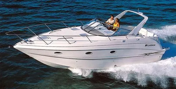 The Image of 2000 Larson 330 CABRIO cruising on open water, showcasing sleek design and performance. - 0