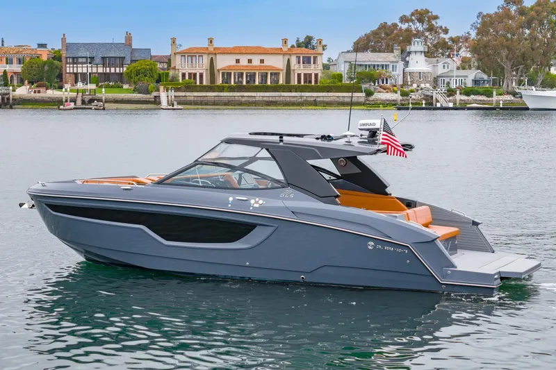 Slide: The Image of 2022 Cruisers Yachts 38 GLS in a scenic waterfront setting. - 0