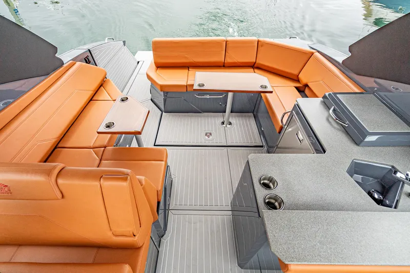 Slide: The Image of 2022 Cruisers Yachts 38 GLS interior with orange seating and modern amenities. - 18