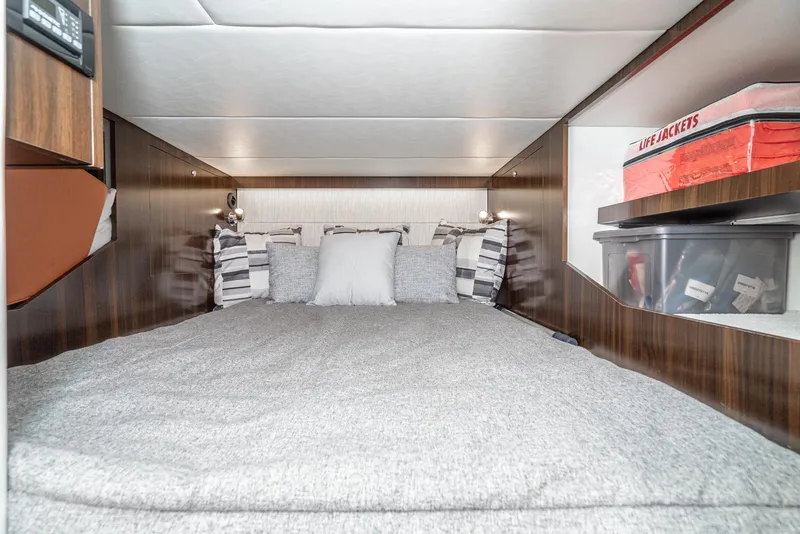 Slide: The Image of 2022 Cruisers Yachts 38 GLS cabin interior with bed and storage. - 31