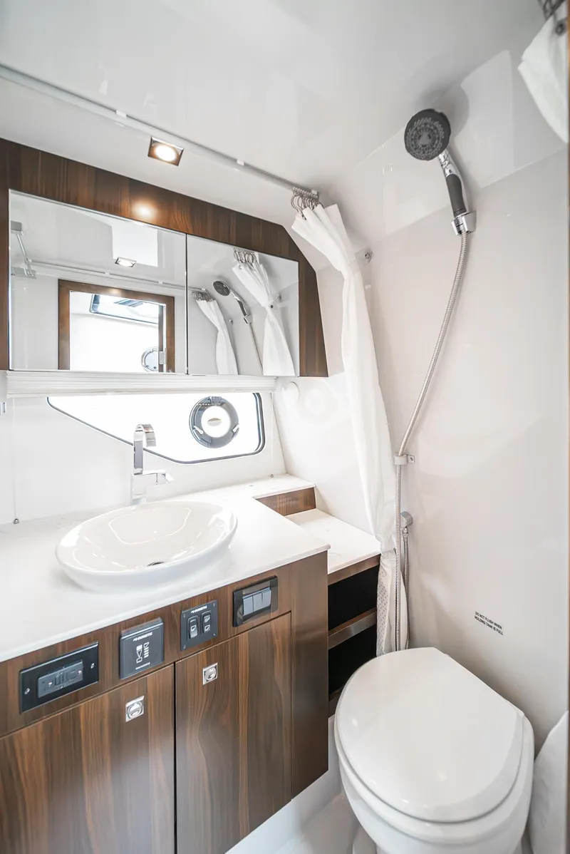 Slide: The Image of Luxurious bathroom in 2022 Cruisers Yachts 38 GLS, featuring modern fixtures and elegant design. - 32