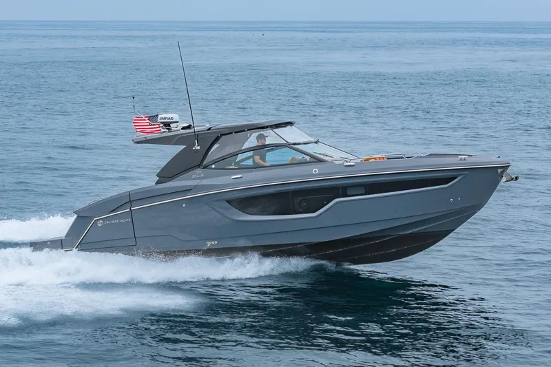 Slide: The Image of 2022 Cruisers Yachts 38 GLS speeding on open water, showcasing sleek design and performance. - 4