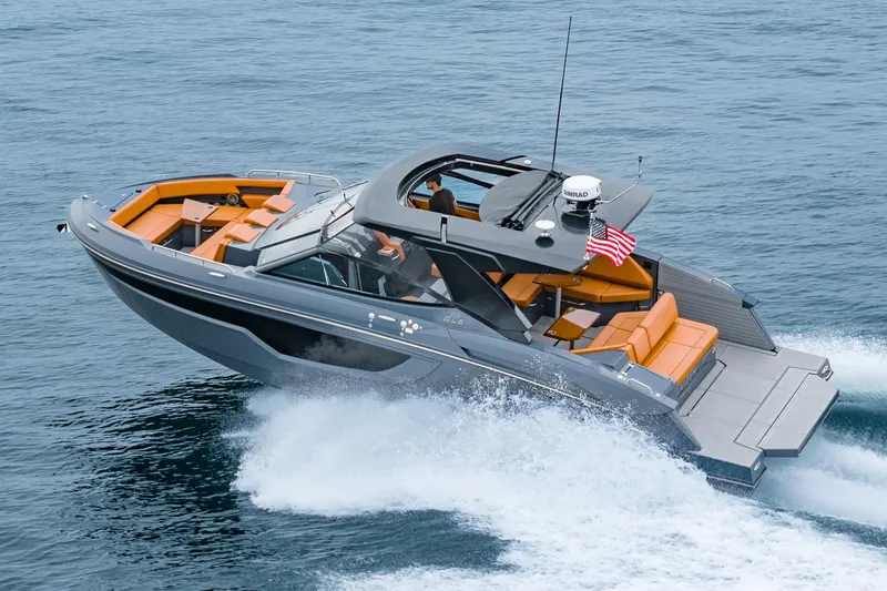 Slide: The Image of 2022 Cruisers Yachts 38 GLS cruising on open water, featuring sleek design and luxurious seating. - 5