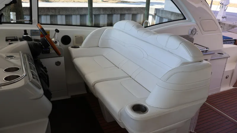 Slide: The Image of 2007 Formula 45 Yacht interior with white leather seating and helm controls. - 19