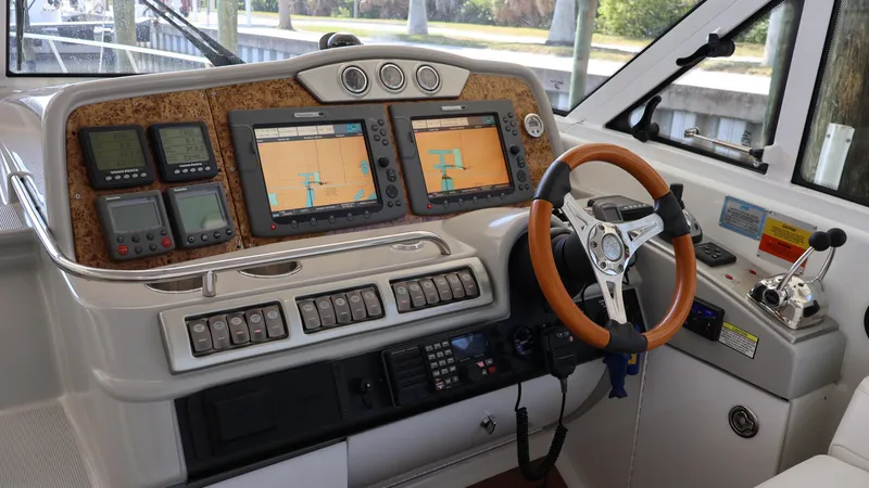 Slide: The Image of 2007 Formula 45 Yacht dashboard with navigation screens and controls. - 21