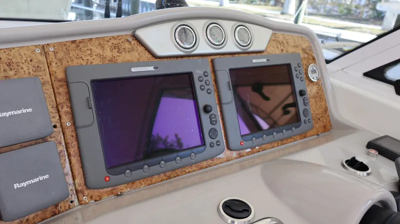 Slide: The Image of Dashboard of 2007 Formula 45 Yacht with dual Raymarine navigation screens. - 22