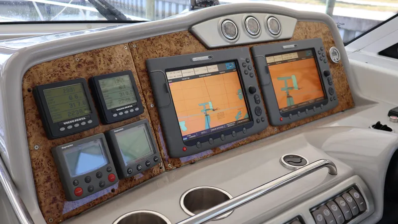 Slide: The Image of Dashboard of a 2007 Formula 45 Yacht with navigation screens and controls. - 23