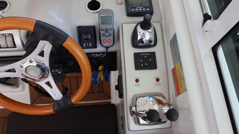 Slide: The Image of 2007 Formula 45 Yacht helm with wooden steering wheel and control panel. - 27