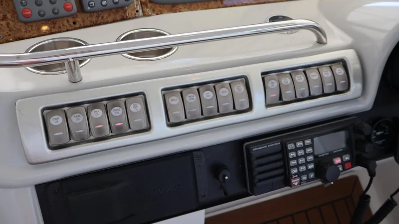 Slide: The Image of Control panel of a 2007 Formula 45 Yacht with switches and communication device. - 29