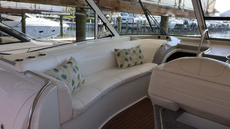 Slide: The Image of 2007 Formula 45 Yacht interior with white seating and decorative pillows. - 31