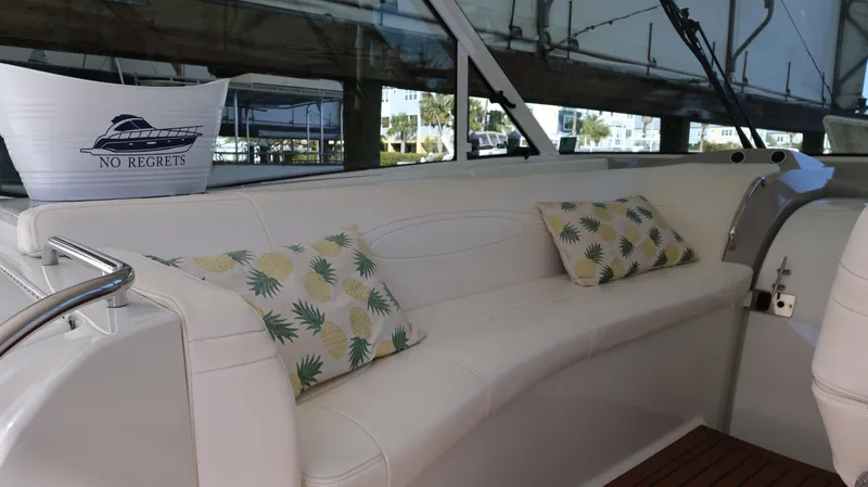 Slide: The Image of 2007 Formula 45 Yacht interior with white seating and tropical cushions. - 32