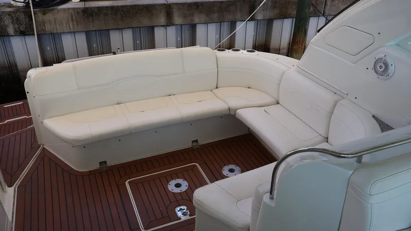 Slide: The Image of 2007 Formula 45 Yacht interior with white seating and wooden deck. - 36