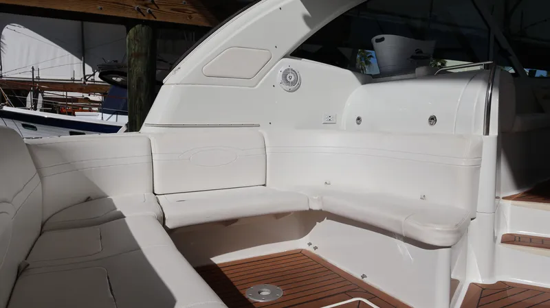 Slide: The Image of 2007 Formula 45 Yacht interior with white seating and wooden flooring. - 37