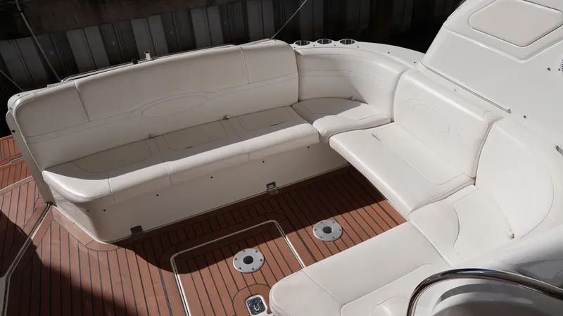 Slide: The Image of 2007 Formula 45 Yacht interior with white seating and wooden flooring. - 38