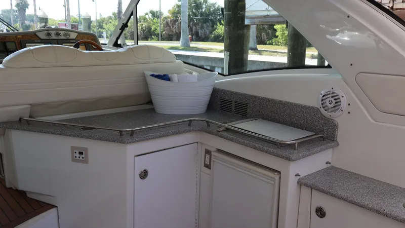 Slide: The Image of Interior view of a 2007 Formula 45 Yacht with a kitchenette and seating area. - 39