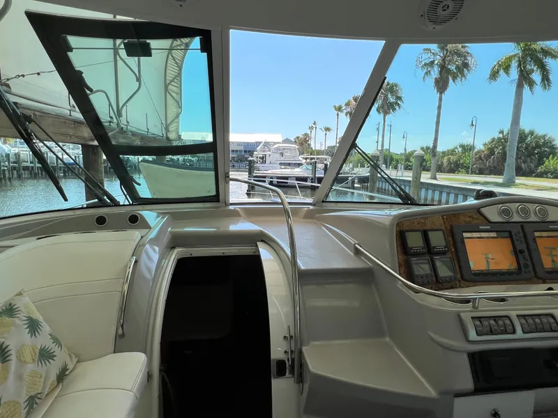 Slide: The Image of Interior view of 2007 Formula 45 Yacht cockpit with navigation controls and marina backdrop. - 41