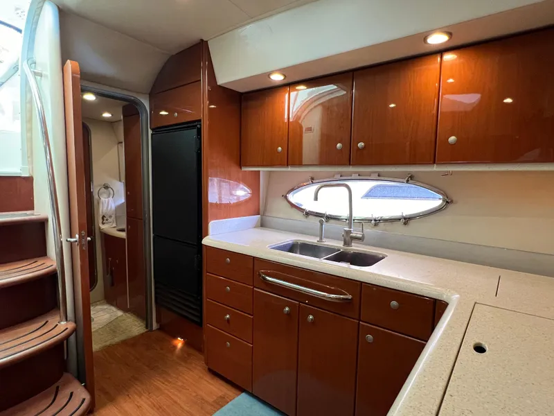 Slide: The Image of Interior of 2007 Formula 45 Yacht kitchen with wood cabinets and modern fixtures. - 42