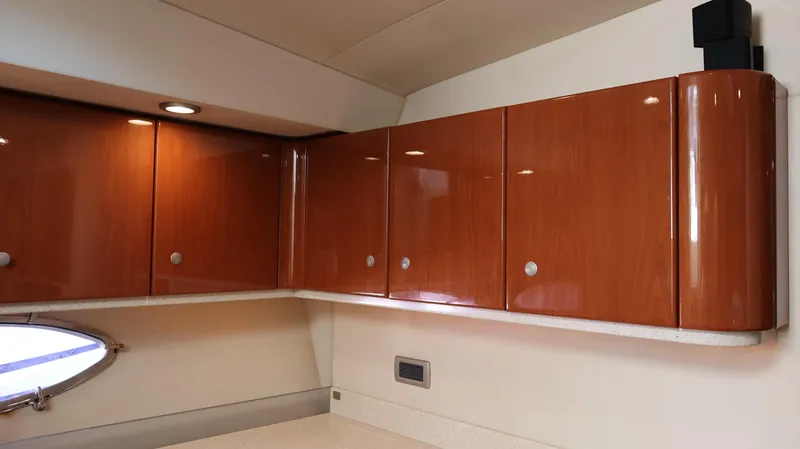 Slide: The Image of Wooden cabinets inside a 2007 Formula 45 Yacht, featuring sleek design and modern finish. - 43