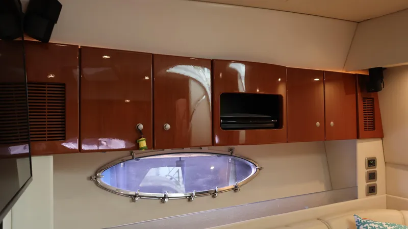 Slide: The Image of Interior of 2007 Formula 45 Yacht with wooden cabinets and oval window. - 44