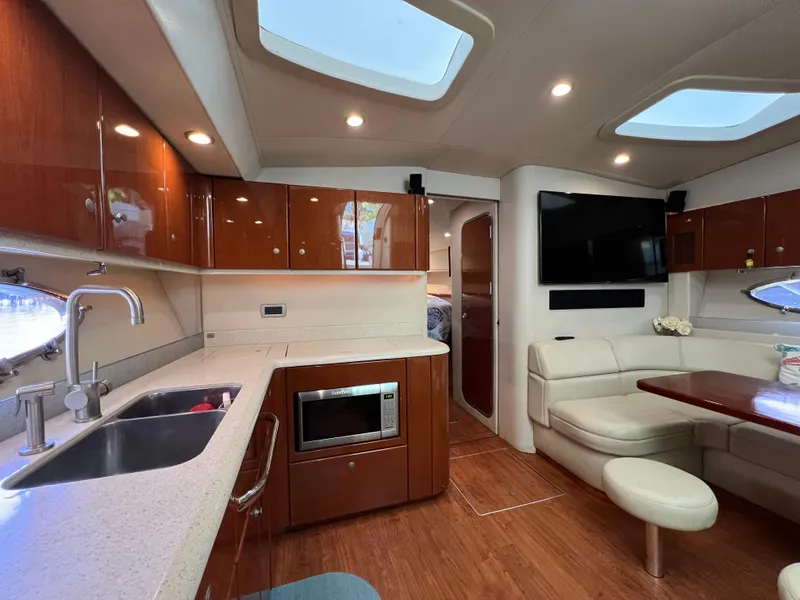 Slide: The Image of Luxurious interior of a 2007 Formula 45 Yacht with modern kitchen and seating area. - 46