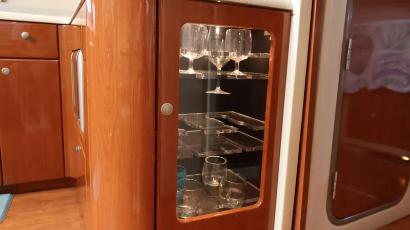 Slide: The Image of Luxury wooden cabinet with glassware inside on a 2007 Formula 45 Yacht. - 47