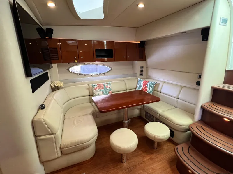 Slide: The Image of 2007 Formula 45 Yacht interior with elegant seating and wooden table. - 48