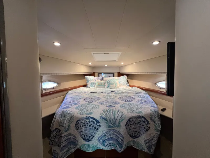 Slide: The Image of Luxurious bedroom interior of 2007 Formula 45 Yacht with seashell-themed bedding. - 52