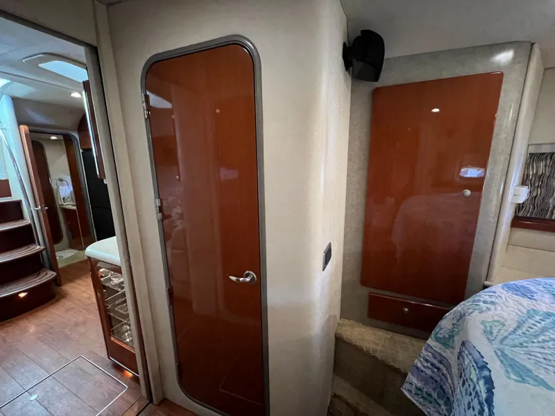 Slide: The Image of Interior of a 2007 Formula 45 Yacht, featuring wooden cabinetry and modern design elements. - 54