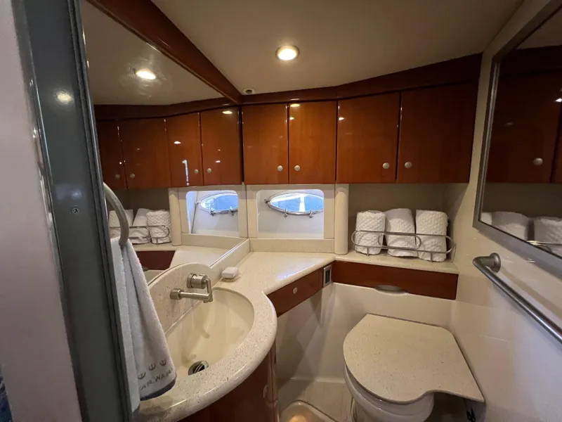 Slide: The Image of Luxurious bathroom in 2007 Formula 45 Yacht with wooden cabinets and modern fixtures. - 55