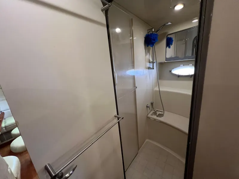 Slide: The Image of Bathroom interior of 2007 Formula 45 Yacht, featuring shower and seating area. - 56