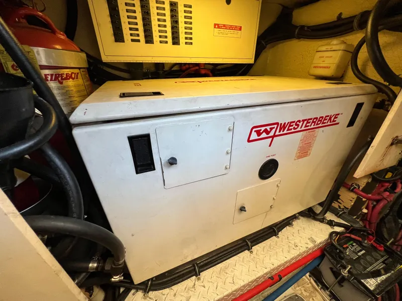 Slide: The Image of Engine room of 2007 Formula 45 Yacht featuring Westerbeke generator. - 61