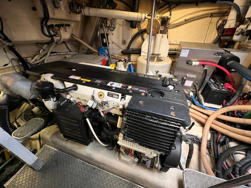 Slide: The Image of Engine room of a 2007 Formula 45 Yacht, showcasing mechanical components and wiring. - 64