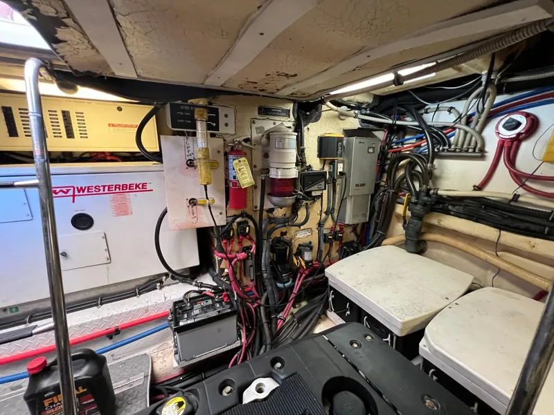 Slide: The Image of Engine room of a 2007 Formula 45 Yacht with Westerbeke generator and electrical components. - 65