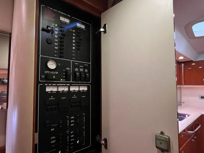 Slide: The Image of Electrical panel inside 2007 Formula 45 Yacht, showcasing circuit breakers and controls. - 66