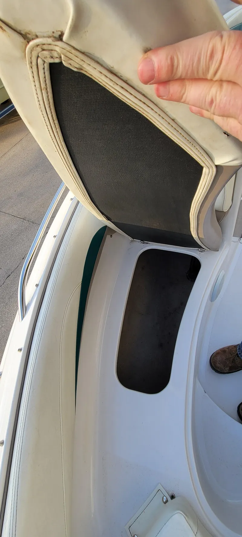 Slide: The Image of 1997 Four Winns 200 Horizon boat interior storage compartment with seat lifted. - 10