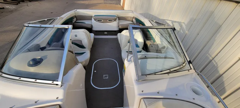 Slide: The Image of 1997 Four Winns 200 Horizon boat dashboard with steering wheel and instrument panel. - 12