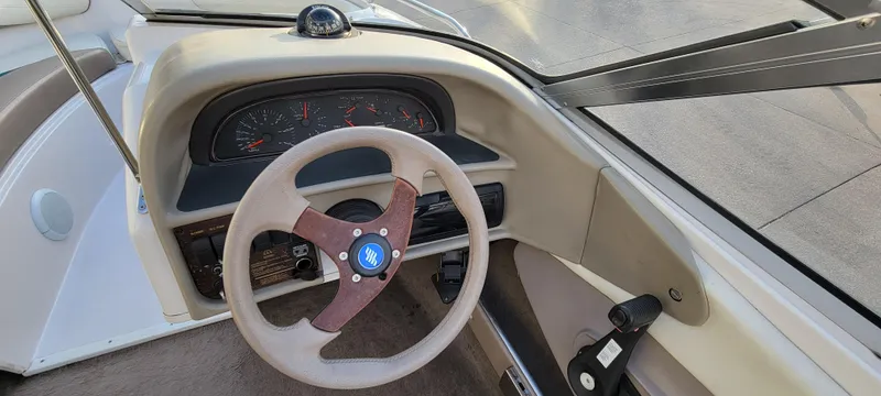 Slide: The Image of 1997 Four Winns 200 Horizon boat interior with seating and storage compartments. - 13