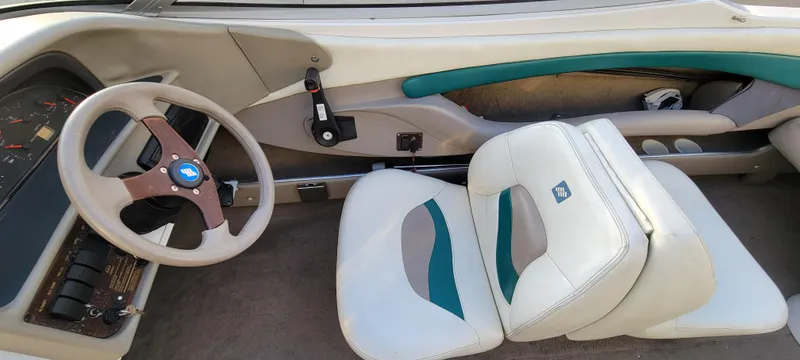 Slide: The Image of 1997 Four Winns 200 Horizon boat interior with white and teal seating. - 15