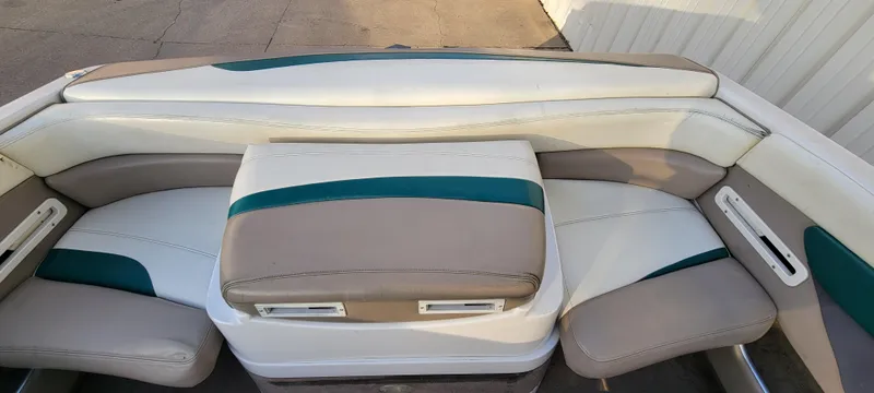 Slide: The Image of Interior of 1997 Four Winns 200 Horizon boat with white and teal seating. - 17