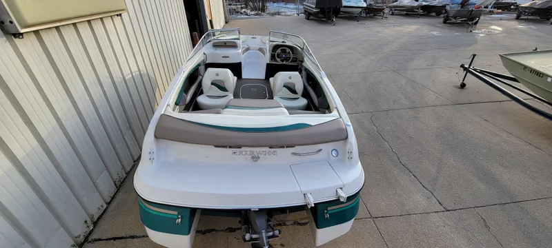 Slide: The Image of 1997 Four Winns 200 Horizon boat, rear view, parked outdoors. - 2