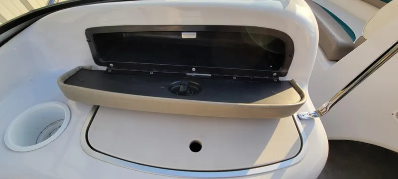 Slide: The Image of Interior of a 1997 Four Winns 200 Horizon boat, featuring seating and side panel details. - 20