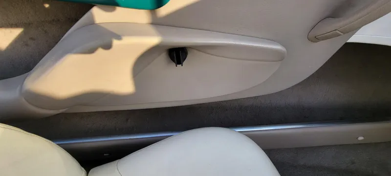 Slide: The Image of Interior of 1997 Four Winns 200 Horizon boat with white and teal seating. - 22