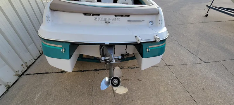 Slide: The Image of 1997 Four Winns 200 Horizon boat, rear view showing propeller and hull design. - 3