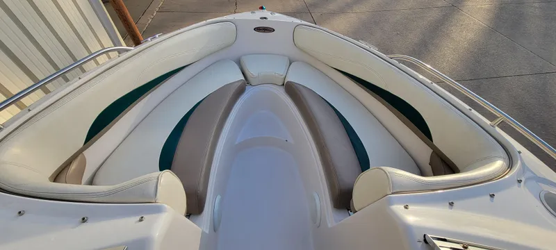 Slide: The Image of 1997 Four Winns 200 Horizon boat interior with white and teal seating. - 8