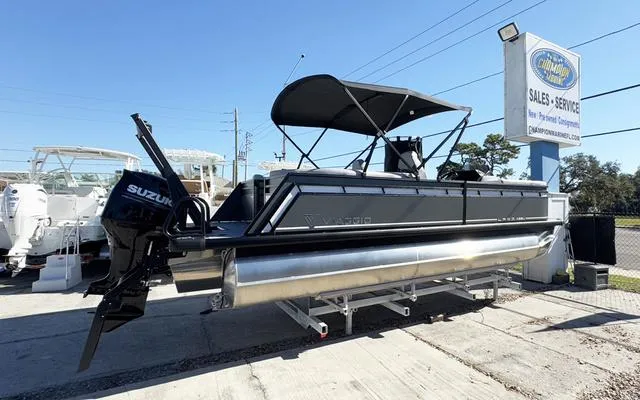 Slide: The Image of 2025 Viaggio Lago X22U pontoon boat with Suzuki engine at dealership. - 1