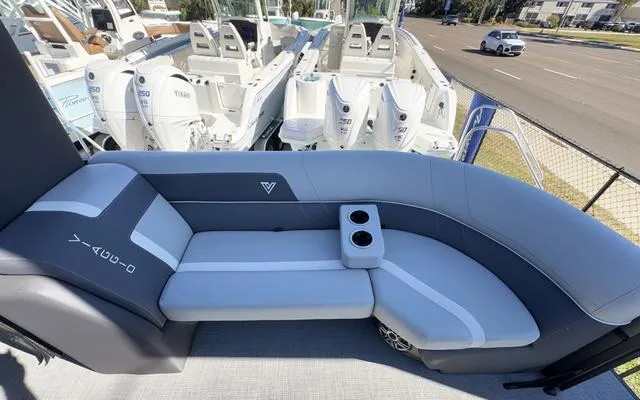 Slide: The Image of 2025 Viaggio Lago X22U boat interior with gray seating and cup holders. - 14